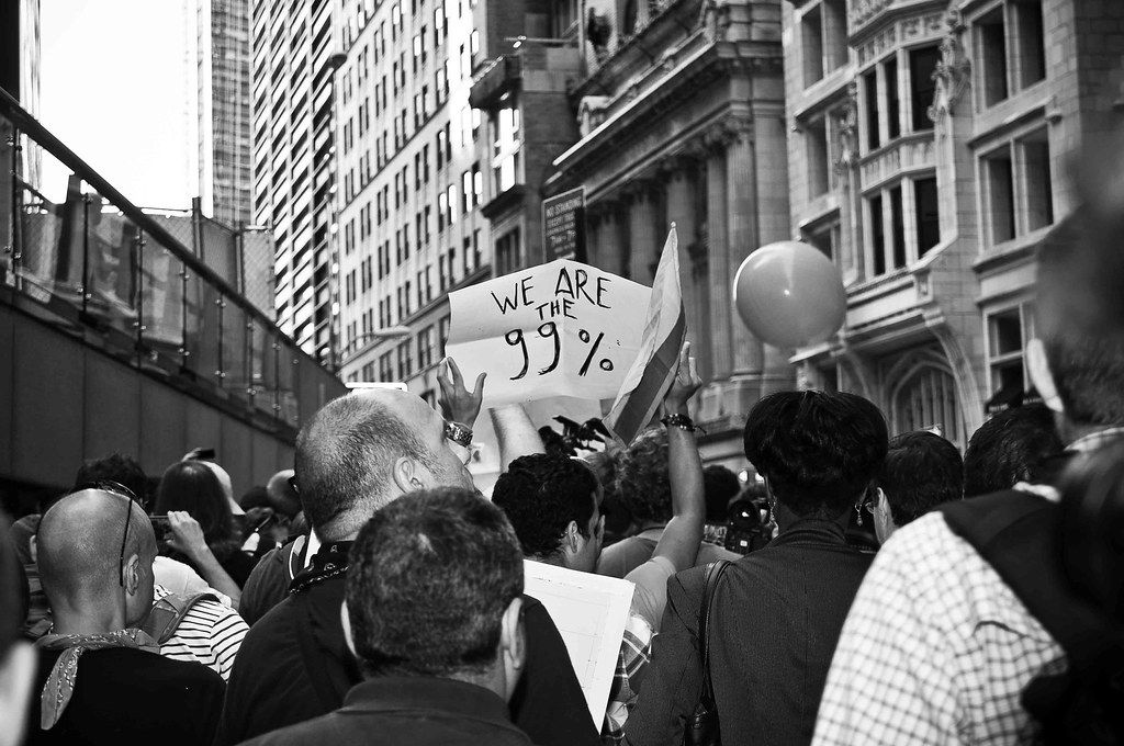 People with "we are the 99%" t-shirts at Occupy Wall Street protest on November 17, 2011 near the New York City Hall.